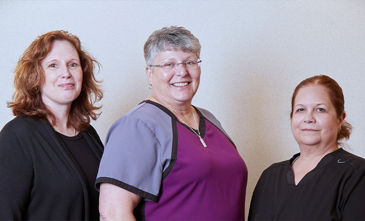 Three smiling dental team members at Flagship Dental Group in Longmeadow