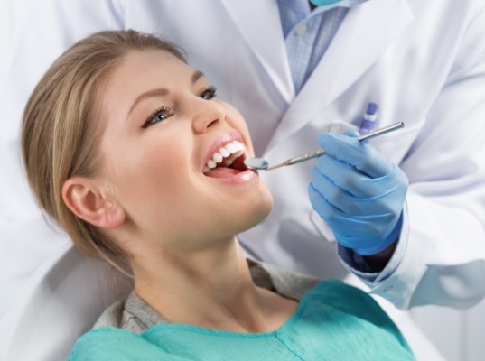 Young woman receiving dental checkup