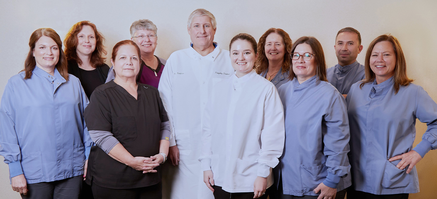 Smiling dentists and team members at Flagship Dental Group