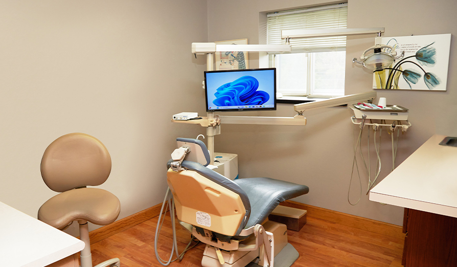 Dental treatment room with plain white walls