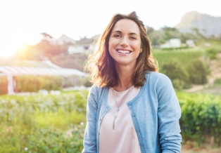 Smiling woman in light blue cardigan