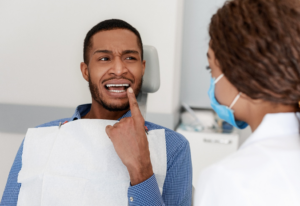 a patient visiting their emergency dentist